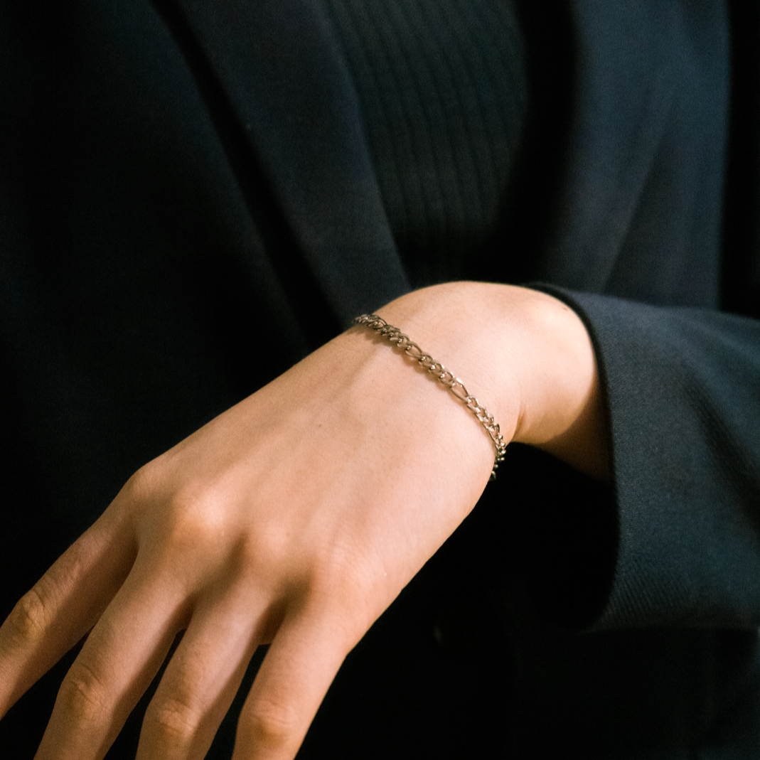 As seen on model: The Figaro Chain Bracelet (3mm)